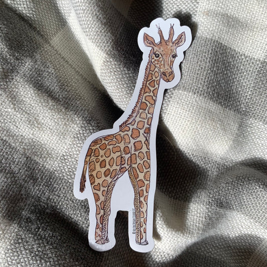 sticker of a watercolor giraffe on top of plaid flannel background